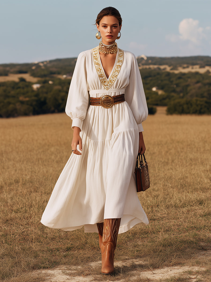 Vestido largo de lino blanco con escote en V y bordado dorado
