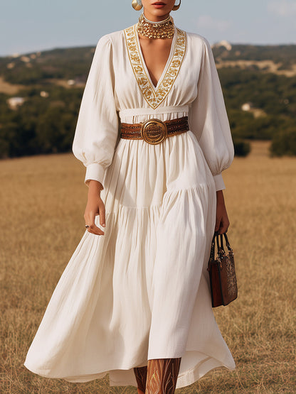 Vestido largo de lino blanco con escote en V y bordado dorado 