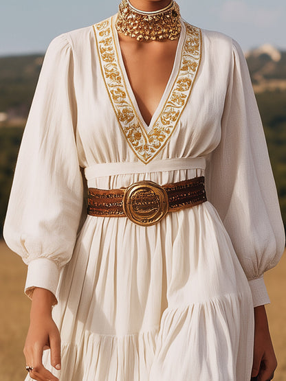 Vestido largo de lino blanco con escote en V y bordado dorado 